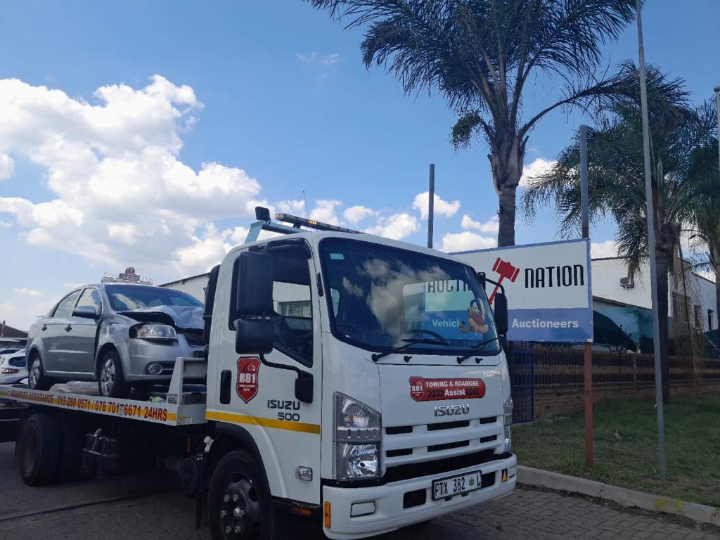 Professional towing truck on the road - Replace with your hero image